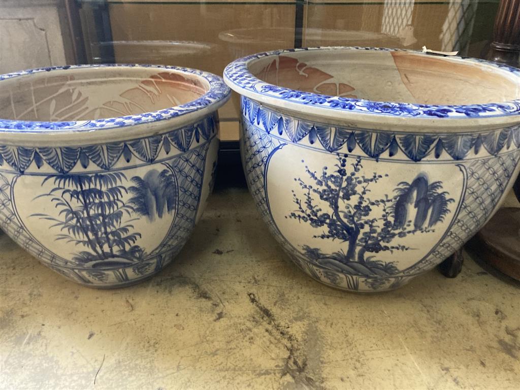 A graduated set of six Chinese style blue and white circular planters, largest width 70cm, height 50cm